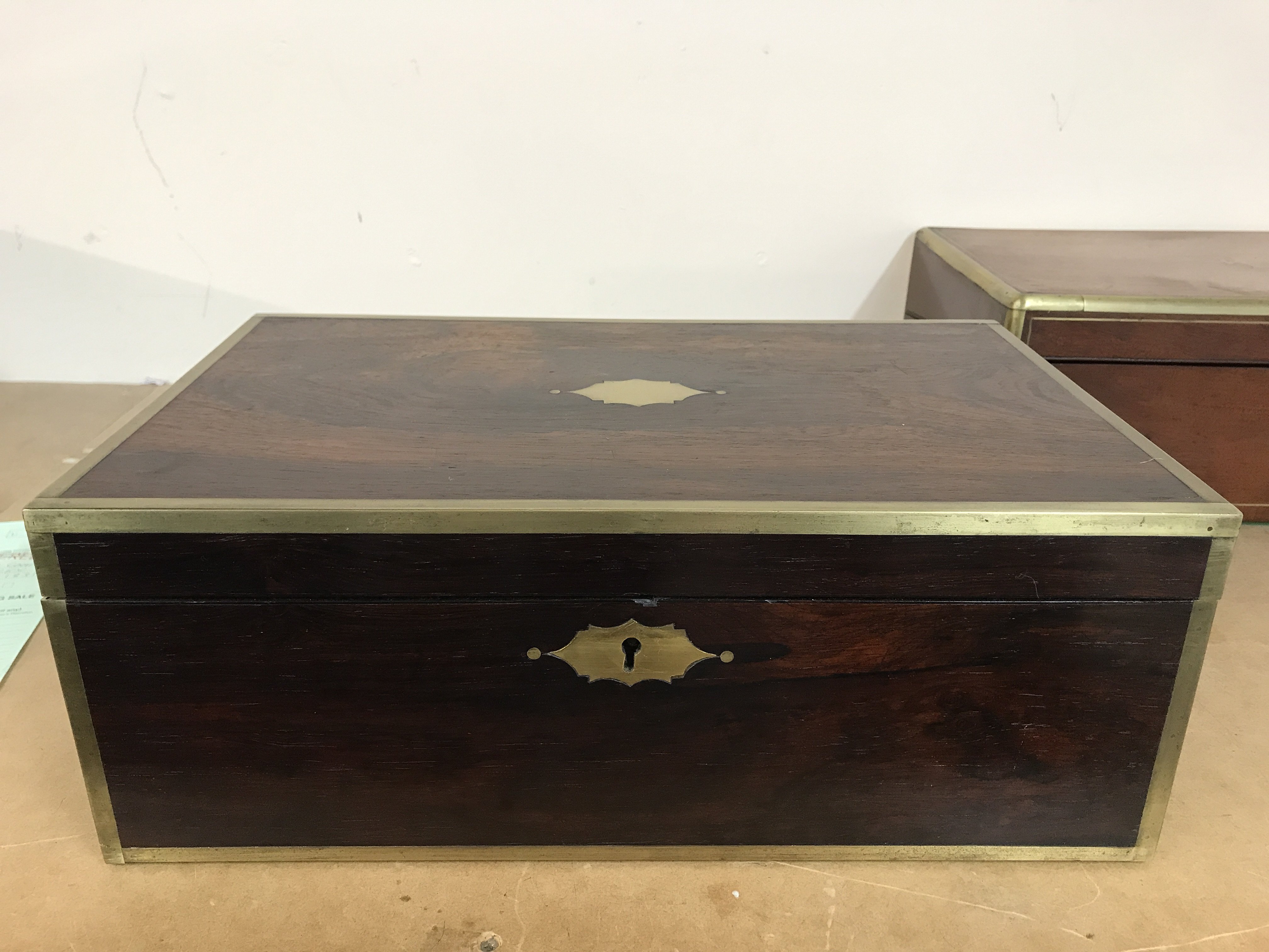 A Victorian rosewood brass bound writing slope wit