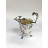 A Victorian silver jug with engraved decoration, L