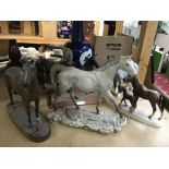 A collection of horse figurines including Beswick