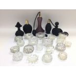 A collection of glass salts, perfume bottles and a