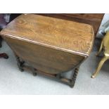 An oak gate leg table 89 wide by 130 by 73 high. N