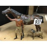 A novelty lighter in the form of a jockey with hor