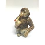 A Beswick figure of a monkey smoking a pipe, appro