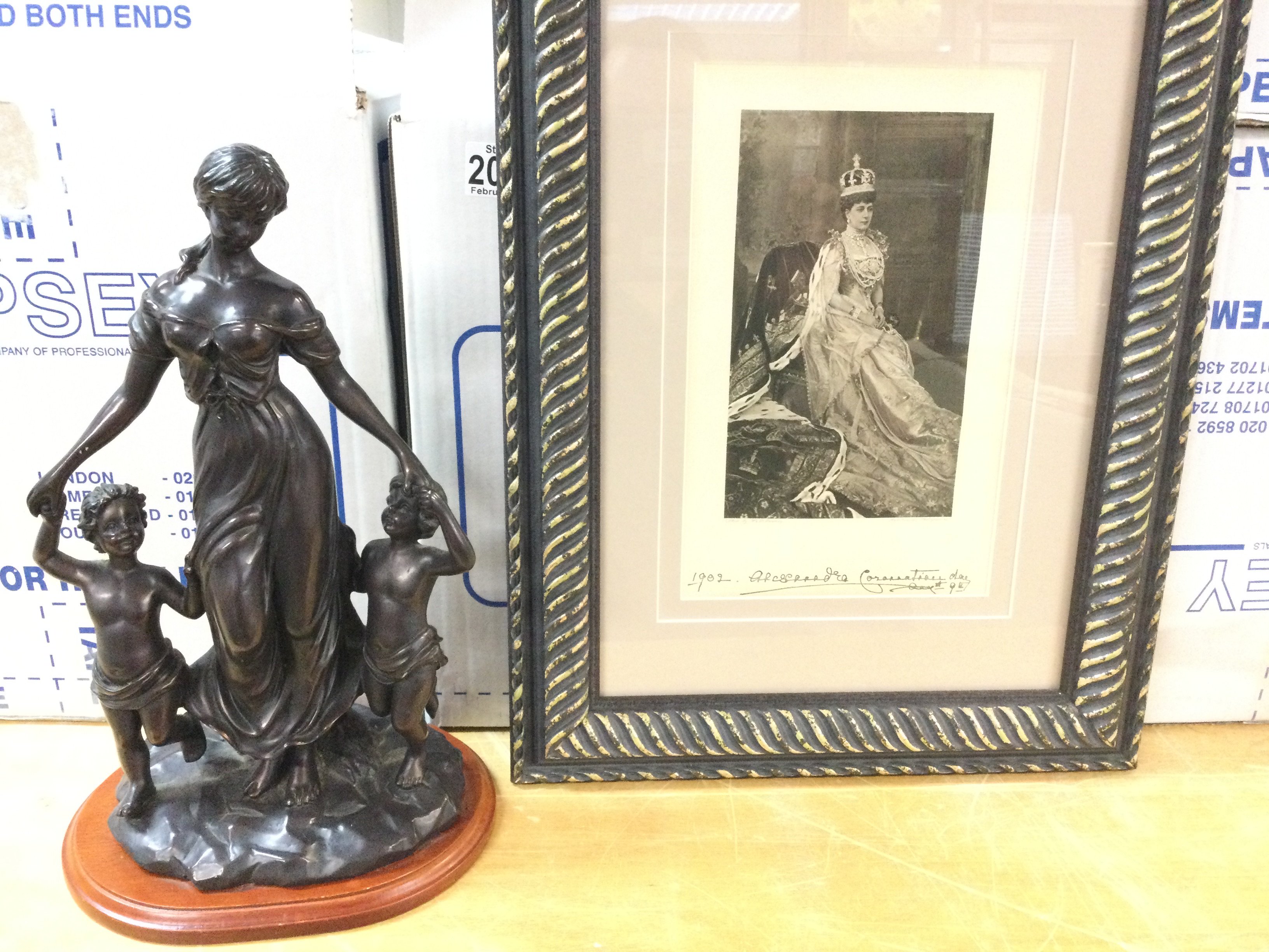 A framed picture of H M queen Alexandra in coronat