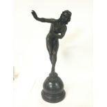 A bronze figure of a dancing nude maiden, signed C