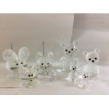 A collection of Swarovski mice and bears in varyin