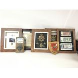 Framed helmet plates, cloth badges, pins and frame