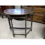 A small 1930s oak drop leaf table, barley twist su