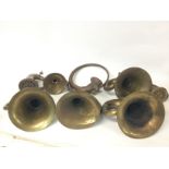 A collection of antique brass car horns