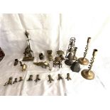 A collection of brass trinkets including candlesti