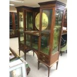 An Edwardian inlaid mahogany display cabinet with central circular mirror, approx 143cm x 46cm x