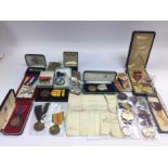 A collection of various medals including a 1940s P