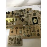 A good collection of British military cap badges m