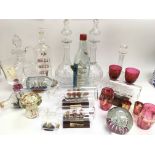 A collection of ship's in bottles, cranberry glass