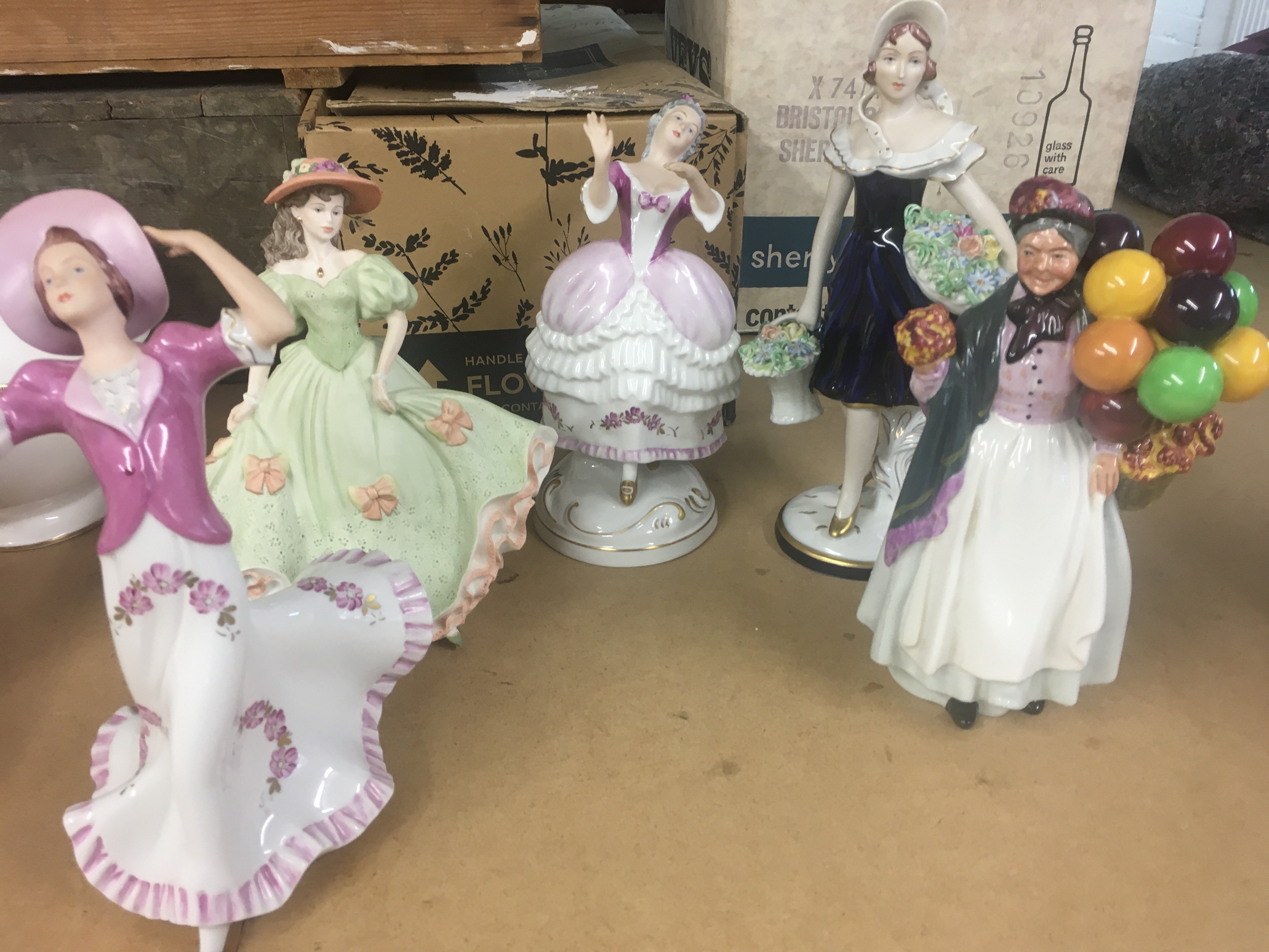A Collection of figures including Royal Doulton an