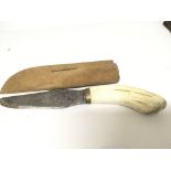 An old hunting knife with a horn handle and steel