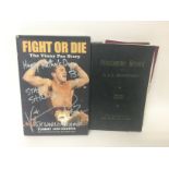 A signed by Vinny Paz and the author Fight or Die