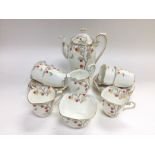 A Art Deco style tea set decorated with flowers an