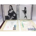 A binder of first day covers and a binder of vinta