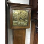 A walnut longcase clock with a brass dial, approx