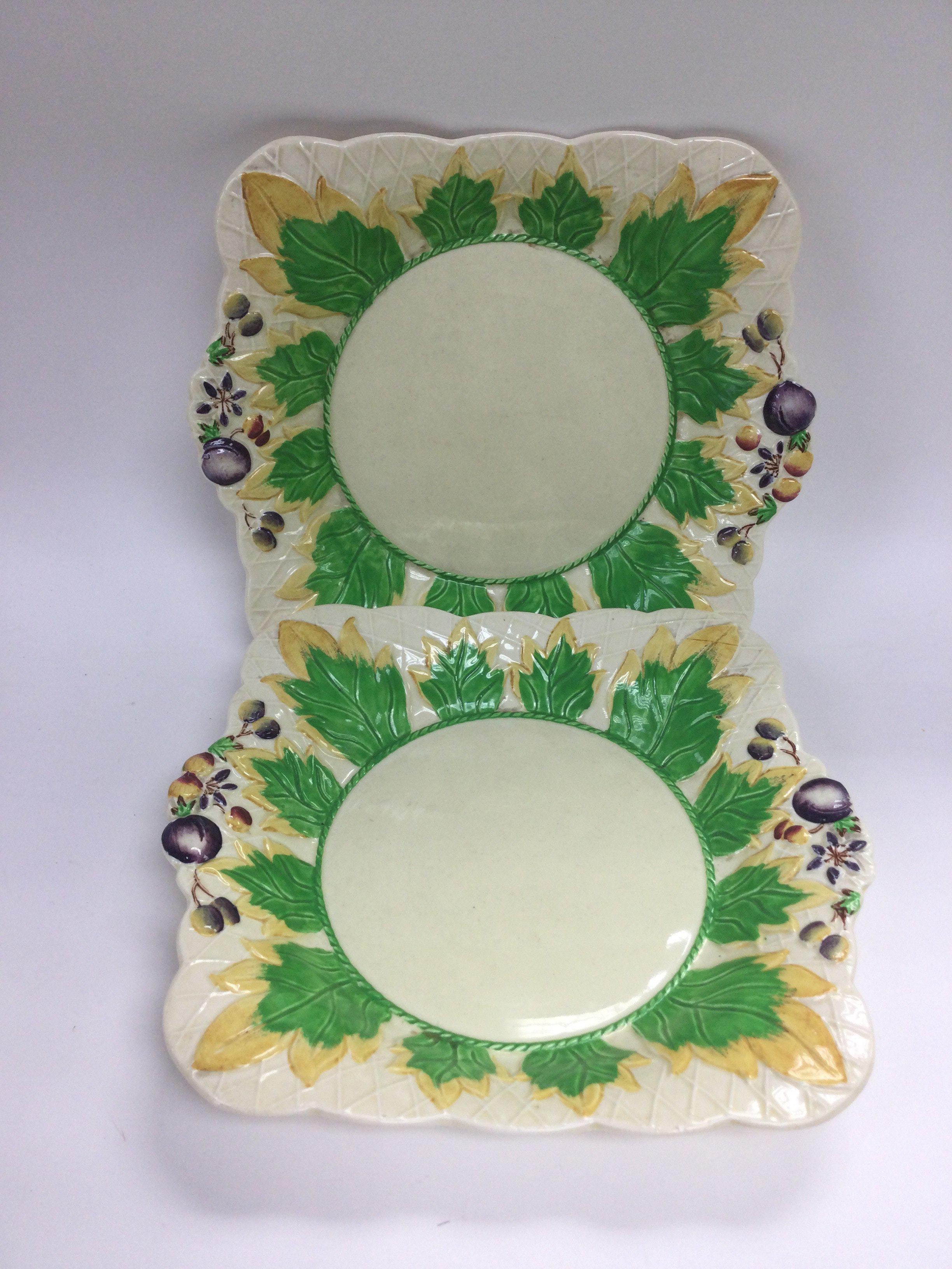 A pair of Clarice Cliff dishes decorated with leav