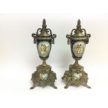 A pair of Classical style ceramic and brass clock