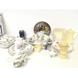 A collection of various ceramic dinnerware and tea