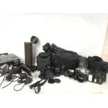 A collection of cased vintage cameras and equipmen