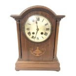 An Edwardian inlaid mahogany mantle clock, with ke