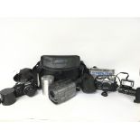 A collection of vintage camera equipment including