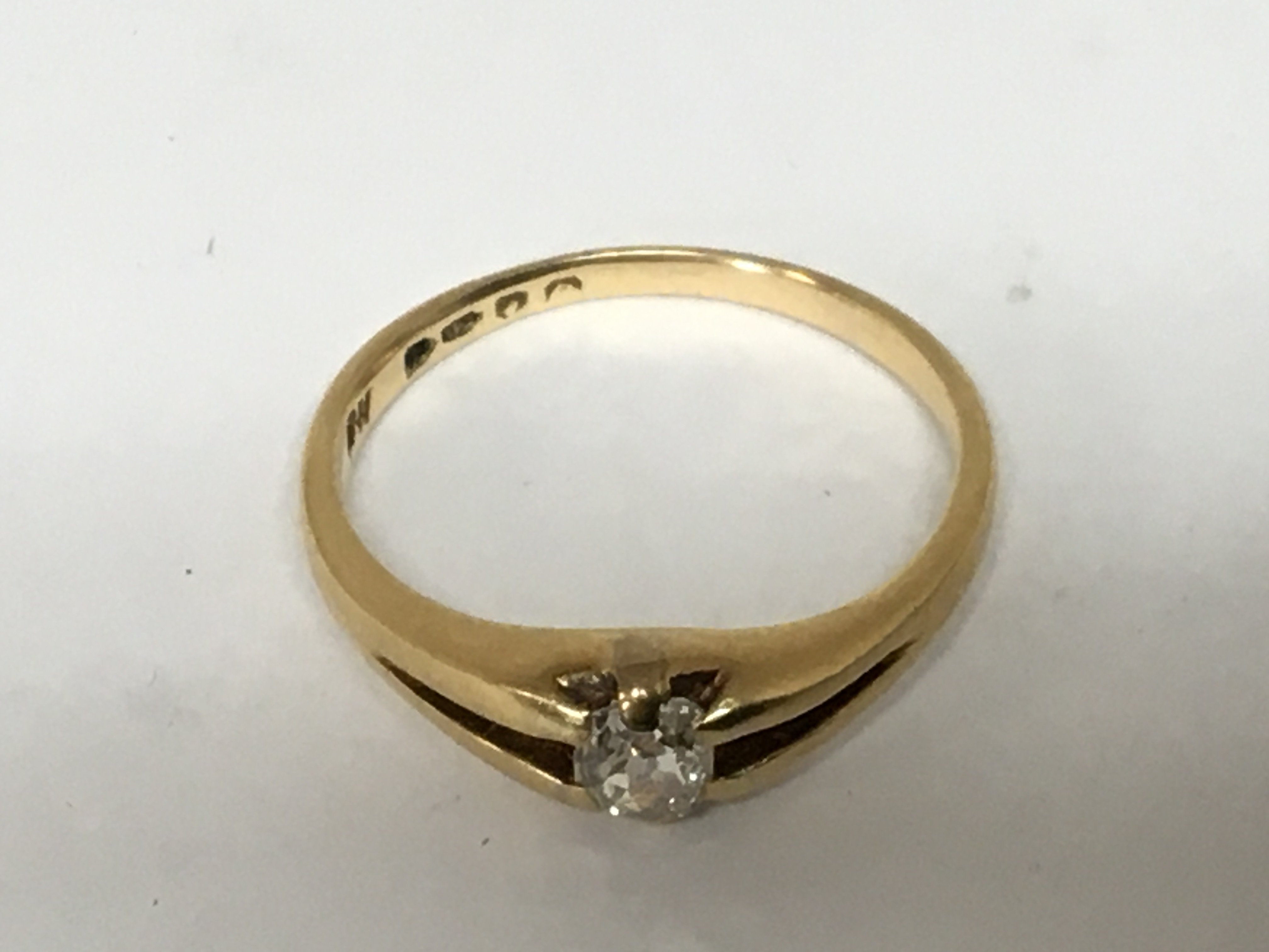 An 18carat gold ring set with a solitaire cushion cut diamonds approximately 0.25-0.3 of a carat