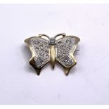 A small high carat yellow and white gold brooch in