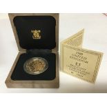 A 1989 gold 22carat Â£5 Brilliant uncirculated coi