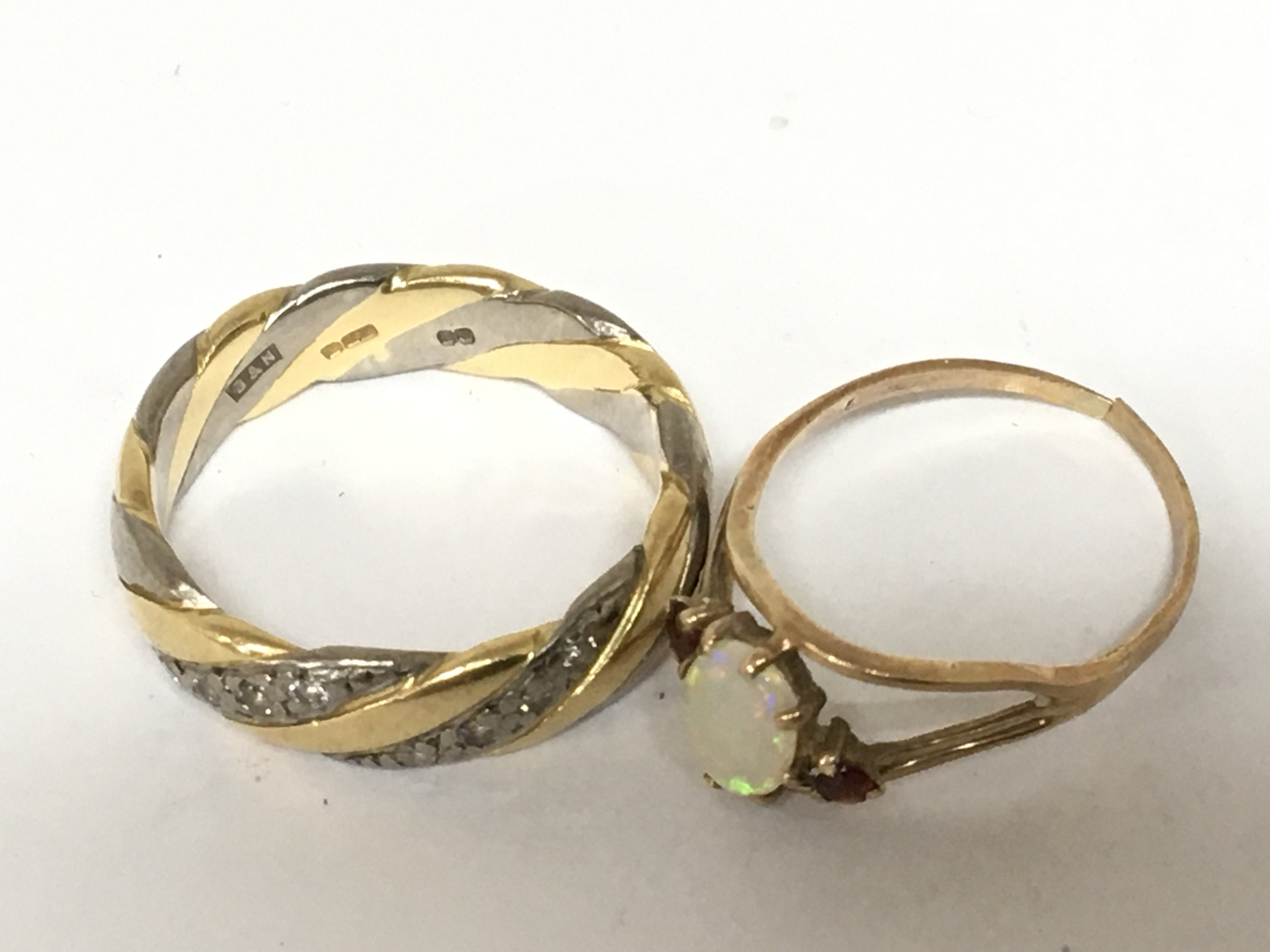 An 18carat white and yellow gold ring set with two