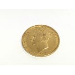 A George IV 1826 full gold sovereign with shield r