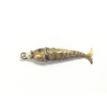 A 9ct gold articulated fish pendant with a pearl s