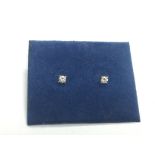 A pair of 9ct gold diamond stud earrings, approx 0