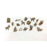 Seventeen gold charms, approx total weight 27.2g (