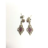 A pair of 9ct gold, diamond and ruby drop earrings