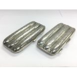 Two silver cigar cases with scroll work decoration, Birmingham 1904. Shipping category A.