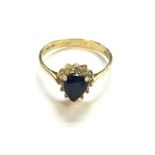 An 18ct gold heart shaped ring with centre gemston