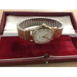 A Garrard wristwatch having 9ct gold case and plat