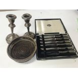 Silver candle sticks , wine coaster and silver kni