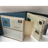 2 coin folios to include Official United Nations M