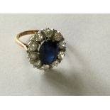 A Sapphire and diamond cluster ring surrounded by