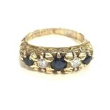 A 9ct gold sapphire and diamond ring. Size I1/2 an