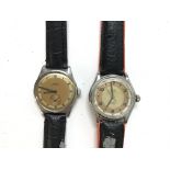 Two vintage military style watches. Including a Cyma Watersport. Both wind and run. Postage B