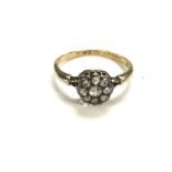 An 18ct gold diamond cluster ring weighing 2.90g a