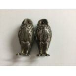 A pair of silver cruets in the form of owls Birmingham hall marks 1998