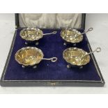 A cased set of hallmarked silver salts and matching spoons.(B).